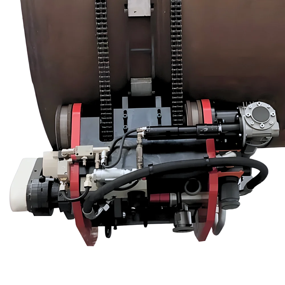 Detaljbild av TAF kap- och fogberedningsmaskin med kedjelåsningssystem och matningshjul